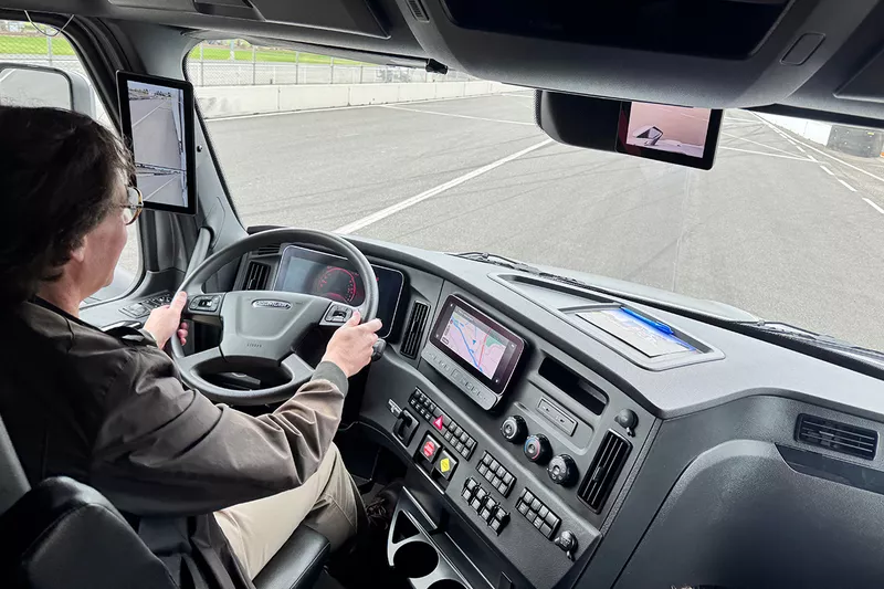 David Sanker driving the Freightliner Cascadia.